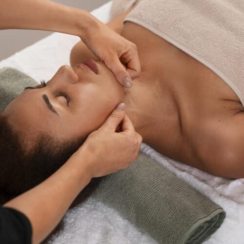 view-woman-getting-facial-yoga-massage-stay-young